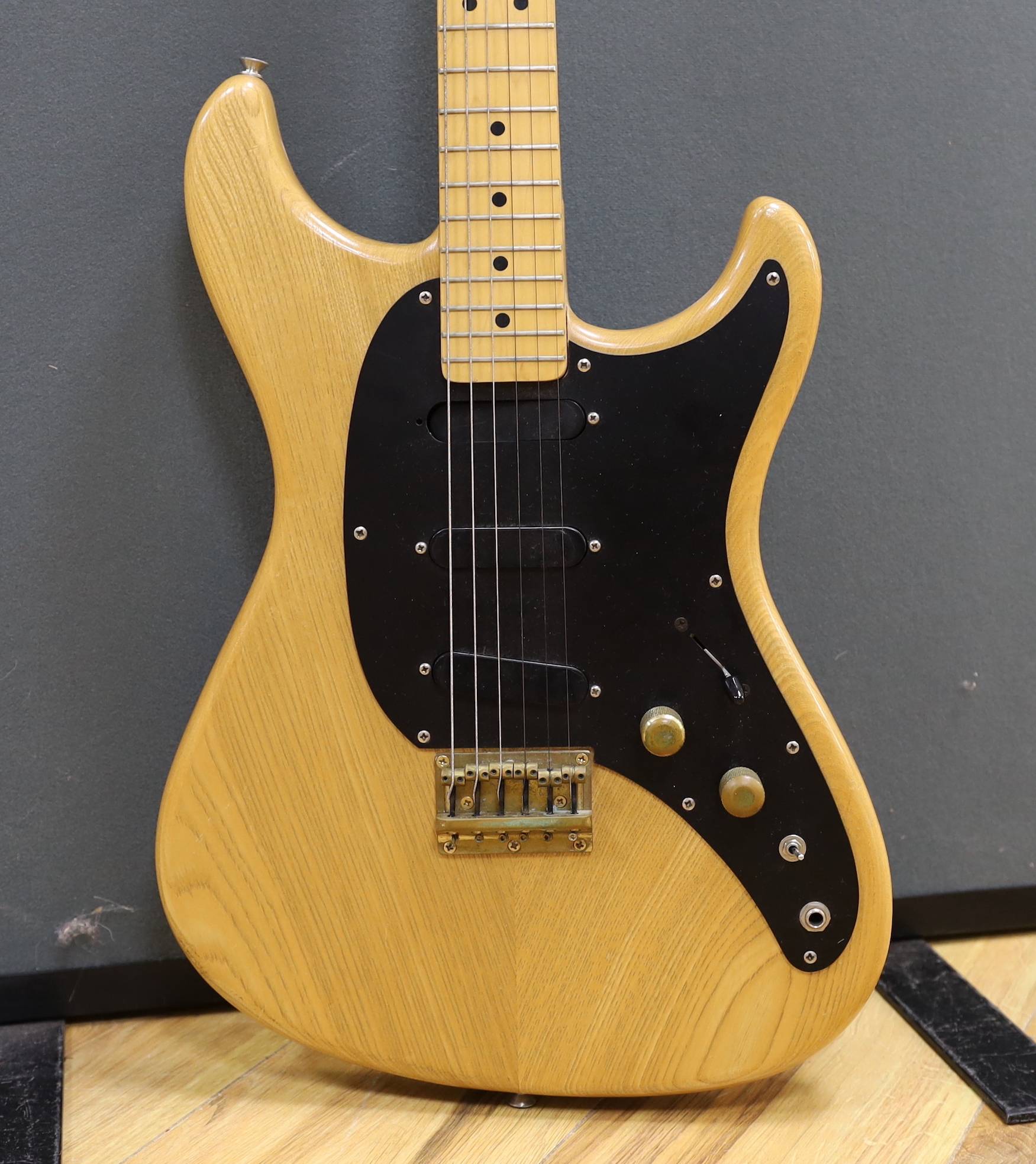 A 1980 Electric guitar by Ibanez, Japan, Blazer Series in natural finish with flight case and a small Fender Frontman 15G amp